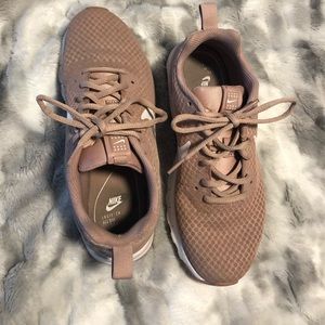 Dusty rose Nike running shoes